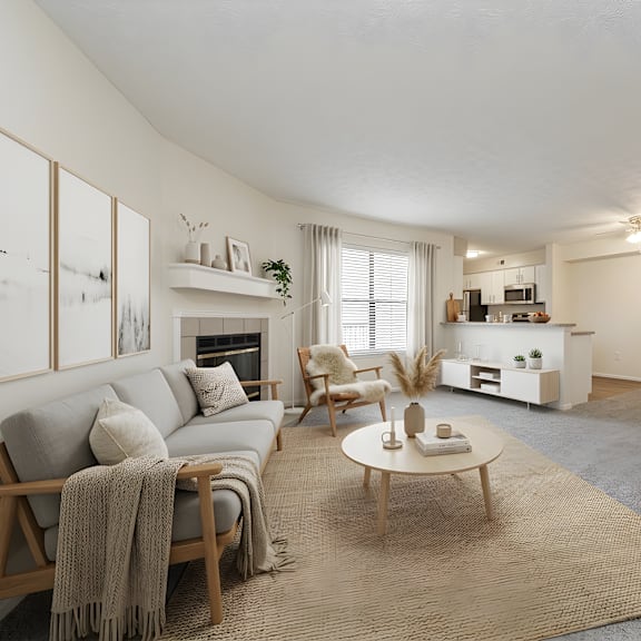 a living room with a grey couch, a wooden coffee table, and a rug at hunt club apartments, apartments, copley, oh