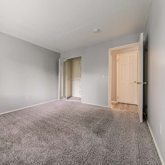 a room with grey carpet and white walls. at integrity berea apartments, ohio