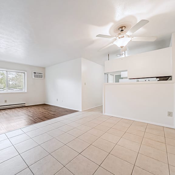 empty room with a ceiling fan and tiled floor.