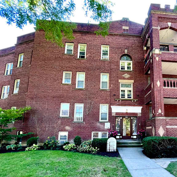 a red brick building with a green tree on top at integrity cleveland heights apartments, cleveland heights, ohio