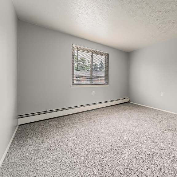 a room with a carpeted floor and a window. at integrity berea apartments, ohio, 44017