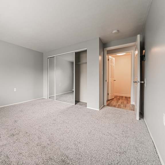 a room with grey carpet and white walls. at integrity berea apartments, berea, oh, 44017