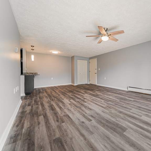 a room with a ceiling fan and wood flooring. at integrity berea apartments, apartments, berea, oh