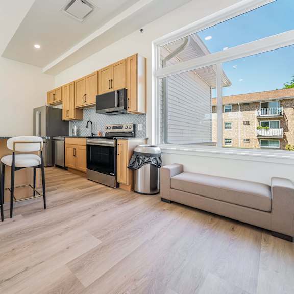 a kitchen with a dining table and chairs.