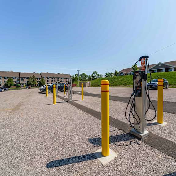 a parking lot with a charging station for electric vehicles.