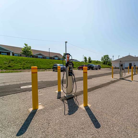 a parking lot with a charging station for electric vehicles.