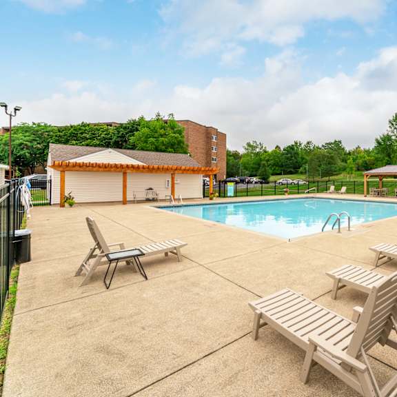 poolside relaxation area at renova of brunswick apartments, brunswick, ohio