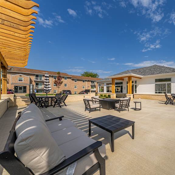 a sunny day at the outdoor seating area of a residential building..