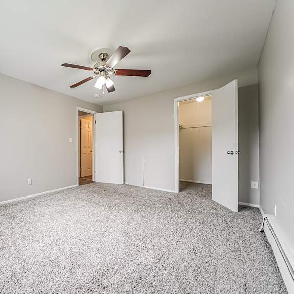 bedroom with walk-in closet and carpeted floor at integrity chardon apartments, chardon