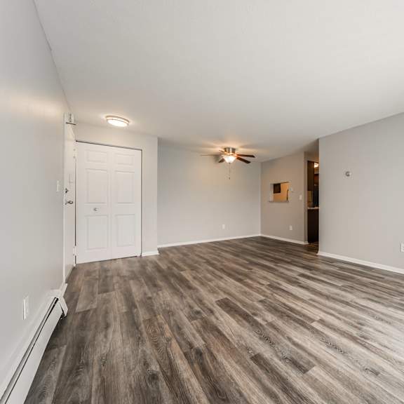 living room with a wooden floor and a ceiling fan at integrity chardon apartments,ohio