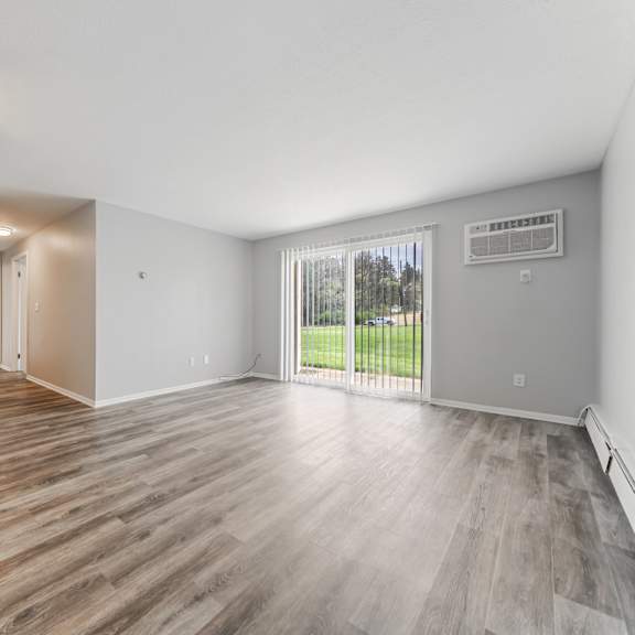 living room with a ceiling fan and wood flooring at integrity chardon apartments, chardon,  ohio