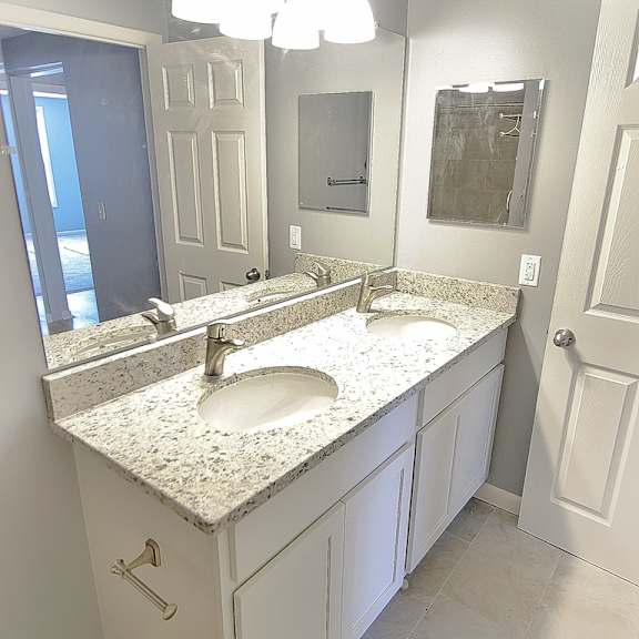 a bathroom with a sink and mirror. at integrity berea apartments, berea, ohio