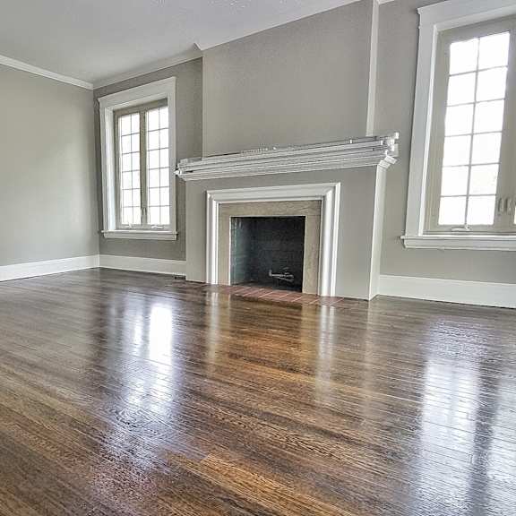 living room with a fireplace and hardwood flooring at integrity gold coast apartments, cleveland, oh, 44102