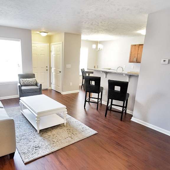 townhome living and kitchen areas with breakfast bar.