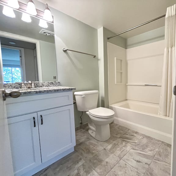 bathroom with bathtub at atrium in the village, beachwood