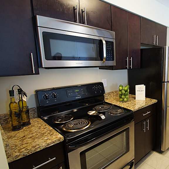 renovated apartment kitchen with stainless steel appliances.