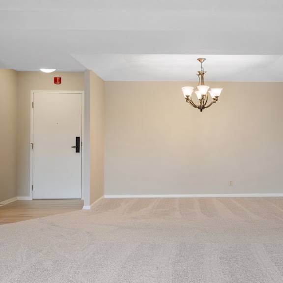 a dining room with a chandelier off of living room.at atrium in the village, beachwood