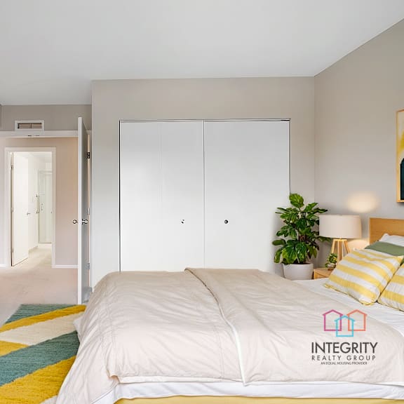 a furnished guest bedroom with a large closet.at atrium in the village, ohio