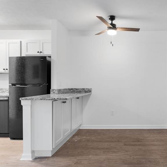 dining area and entryway with breakfast bar and coat closet