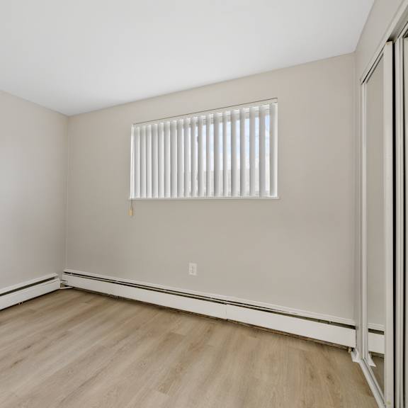 bedroom with a high window.