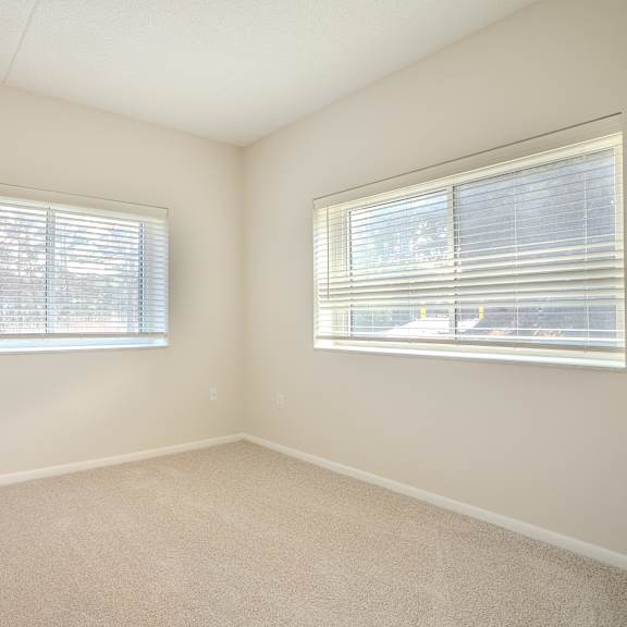 a room with two windows and carpeted floor t atrium in the village,  44122