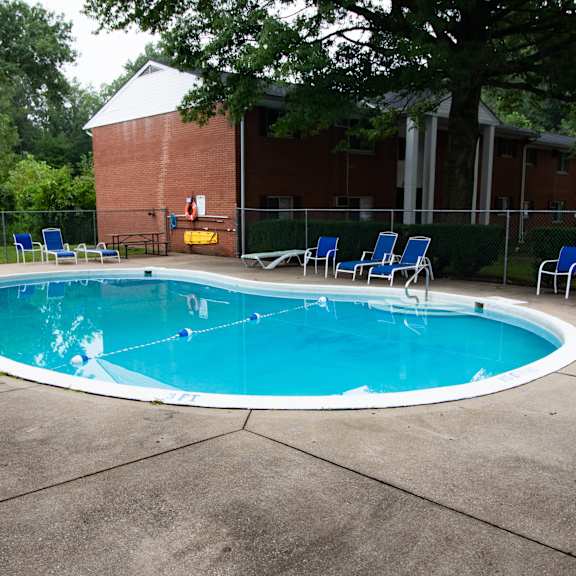 welcoming pool in a wooded setting at ryan place apartments, integrity realty, ohio, 44240