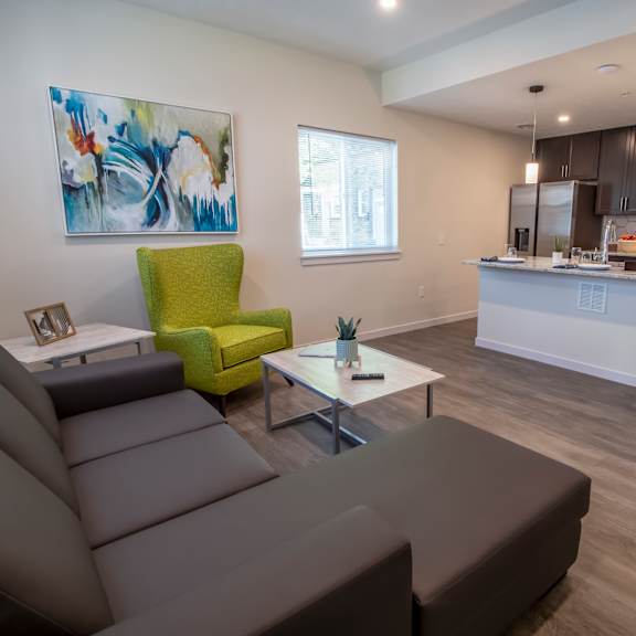view of the shared living room, kitchen and dining island at reserve overlook apartments, integrity realty, cleveland heights