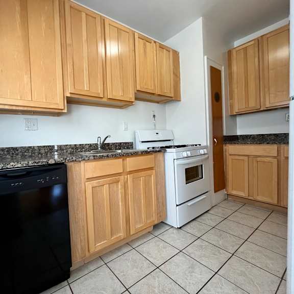 kitchen with maple cabinets and tile floors at integrity cleveland heights, cleveland heights, ohio, 44106
