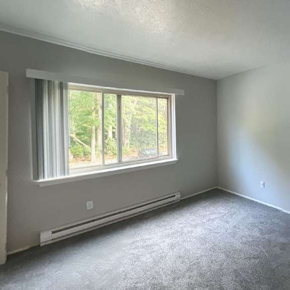 spacious carpeted bedroom at jordan court apartments, integrity realty, 44240