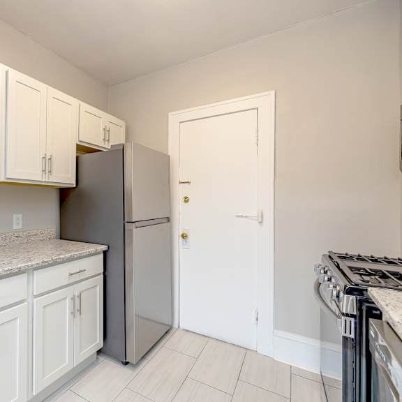 white cabinets in kitchen at heights collection apartments, cleveland heights