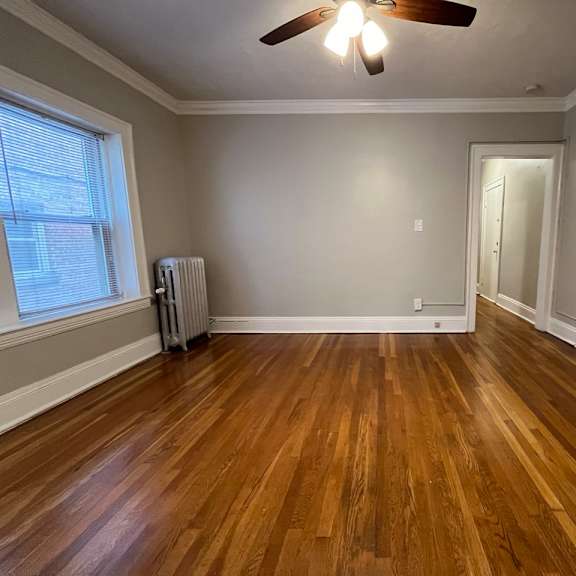 mapleview bedroom with hardwood floors.