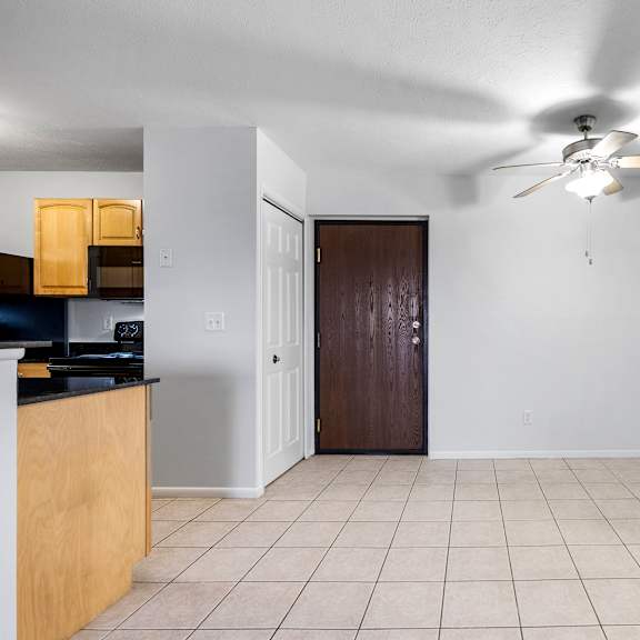 a room with a ceiling fan and a brown door at integrity medina apartments, medina, oh,  44256