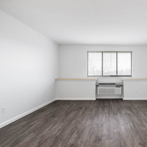 a room with a window and a wooden floor at integrity medina apartments, medina, oh,  44256