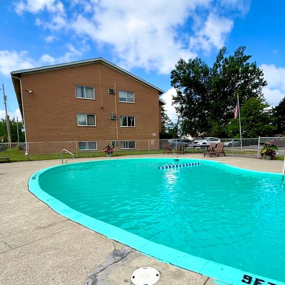 the swimming pool at our community center with our building in the background
