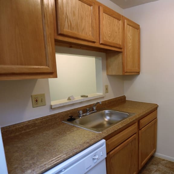 a kitchen with a sink and a refrigerator