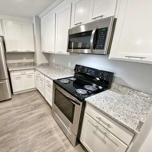 white kitchen cabinetry remodel at old green place apartments, integrity realty llc, beachwood, 44122