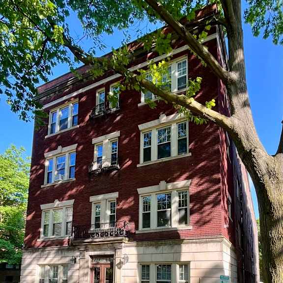 a red brick building with a tree in front. at integrity cleveland heights apartments, cleveland heights, 44106