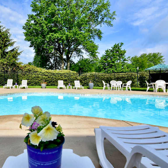 pool with lounge chairs at river run apartments, warren, oh, 44485
