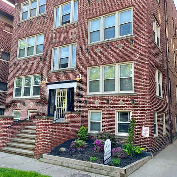 a red brick building with a black door and windows. at integrity cleveland heights apartments, apartments, cleveland heights, oh