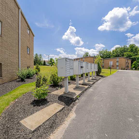 a residential area with a road and apartment buildings.