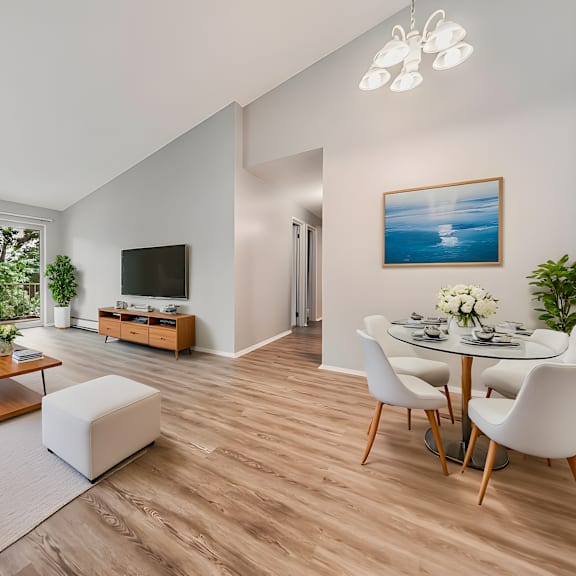 a living room with a white couch, a coffee table, a tv, and a painting on the wall. at integrity berea apartments, apartments, berea, oh