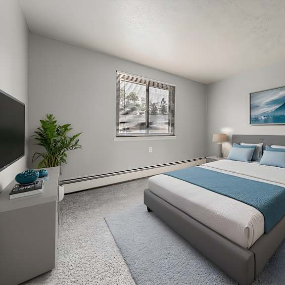 a bedroom with a large bed and a television. at integrity berea apartments, berea, 44017