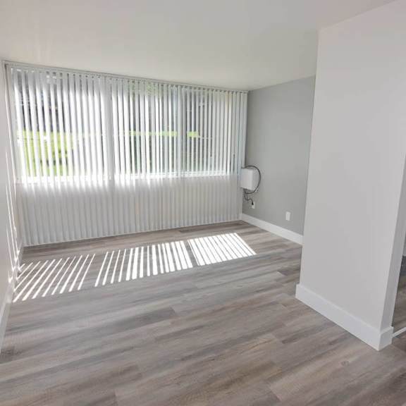 spacious living room with large windows at eagles landing apartments, integrity realty, ohio, 44240