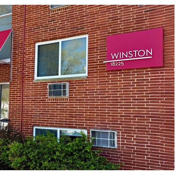 a red building with a sign that says winston 18225.