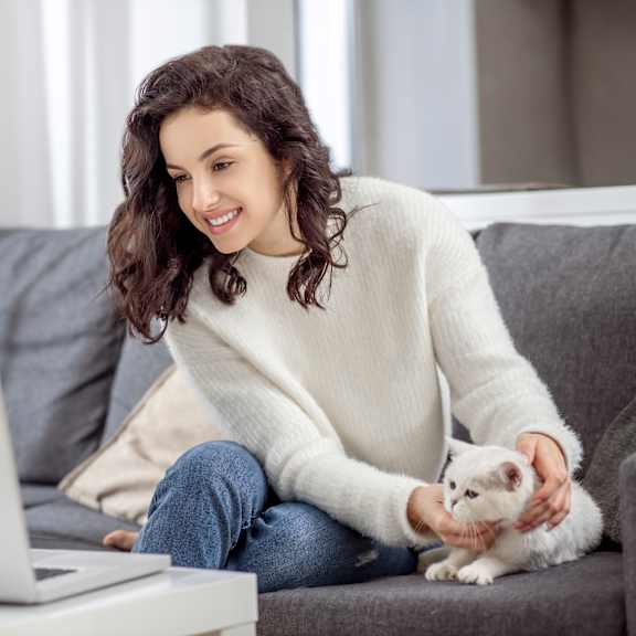 woman on couch with cat