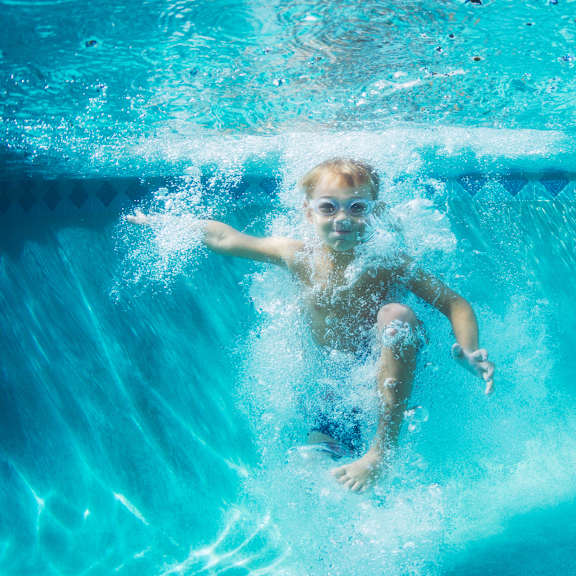 little boy swimming