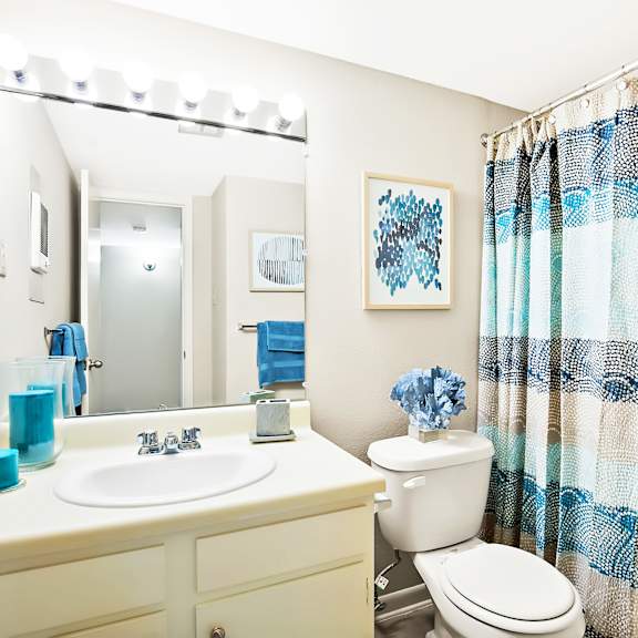 bathroom with shower and bathtub