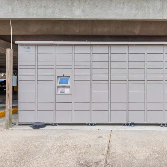 a large grey storage unit with a blue sign on it.
