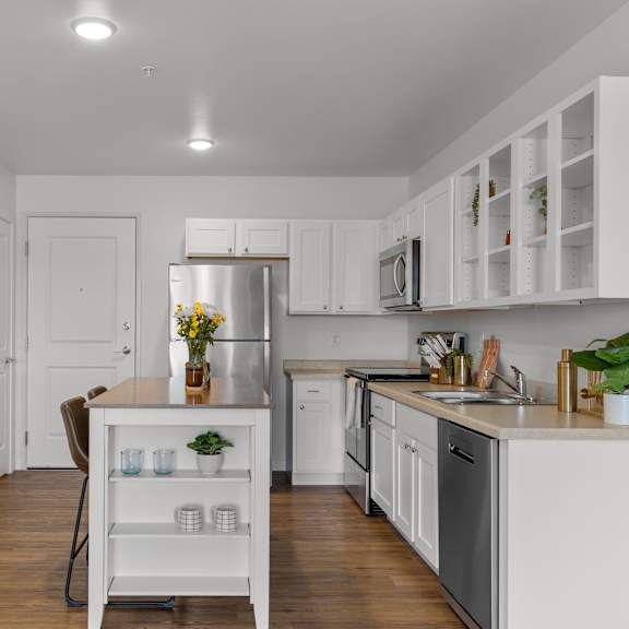 Thumbnail 2 of 21 Kitchen with white cabinetry at Yellowstone Landing, Belgrade, MT