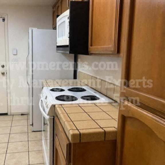 a kitchen with stainless steel appliances and a granite counter top